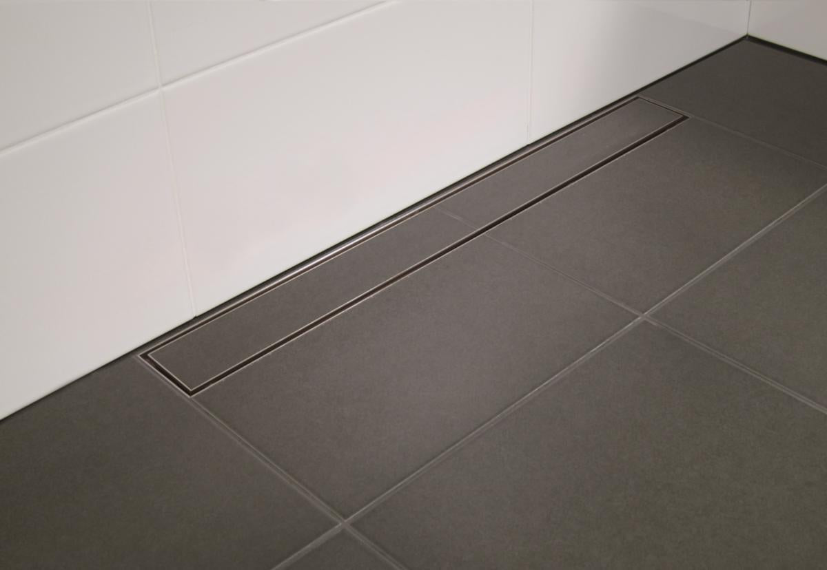 Sluk med bunnutløp Purus Line Tile - Ø75